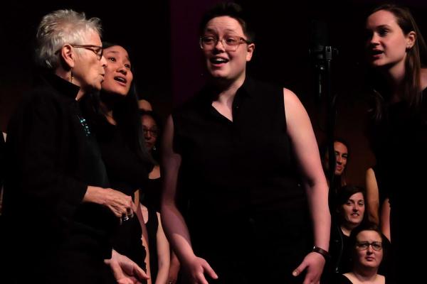 Quartet of women singing in a concert