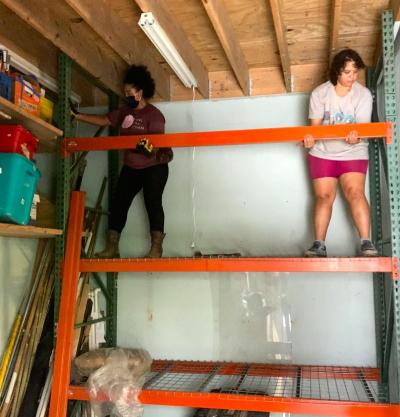 Volunteers are fixing the storage unit after the flood